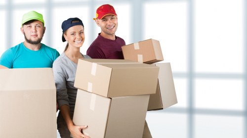 Removal van loading items outside a Wandsworth property