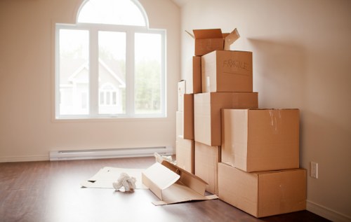 Organised removals team handling boxes and furniture for a home move